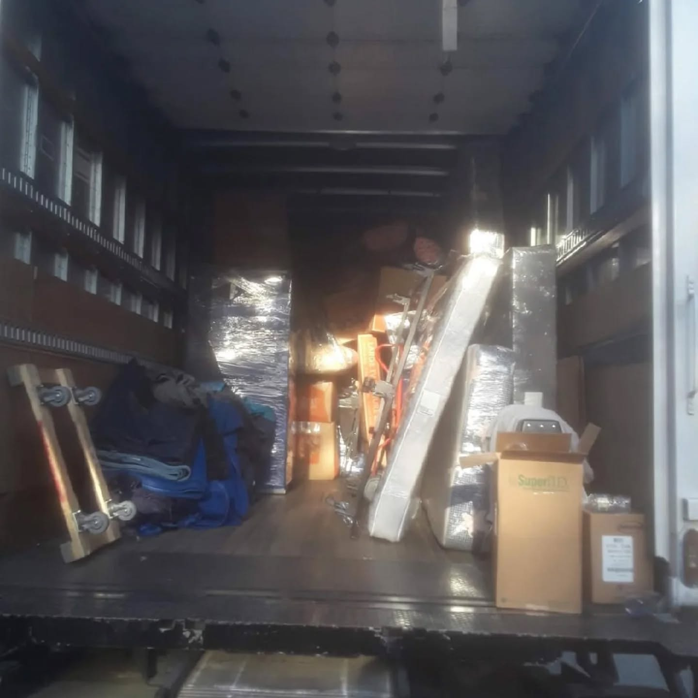 Box truck loaded and prepared for long-distance transport